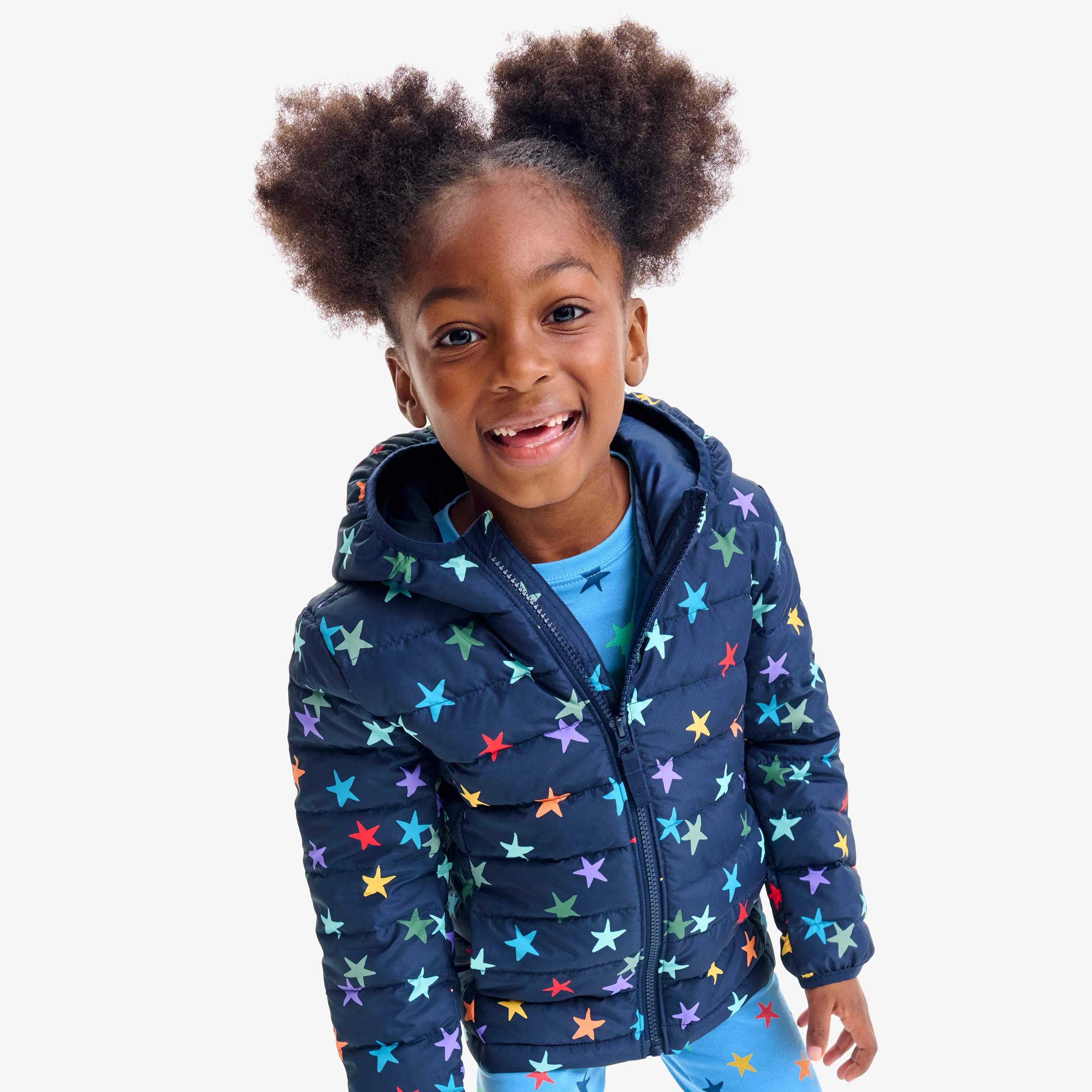 Kids lightweight puffer jacket in rainbow confetti stars 1 16639-kids-lightweight-puffer-jacket-in-rainbow-confetti-stars-1.webp