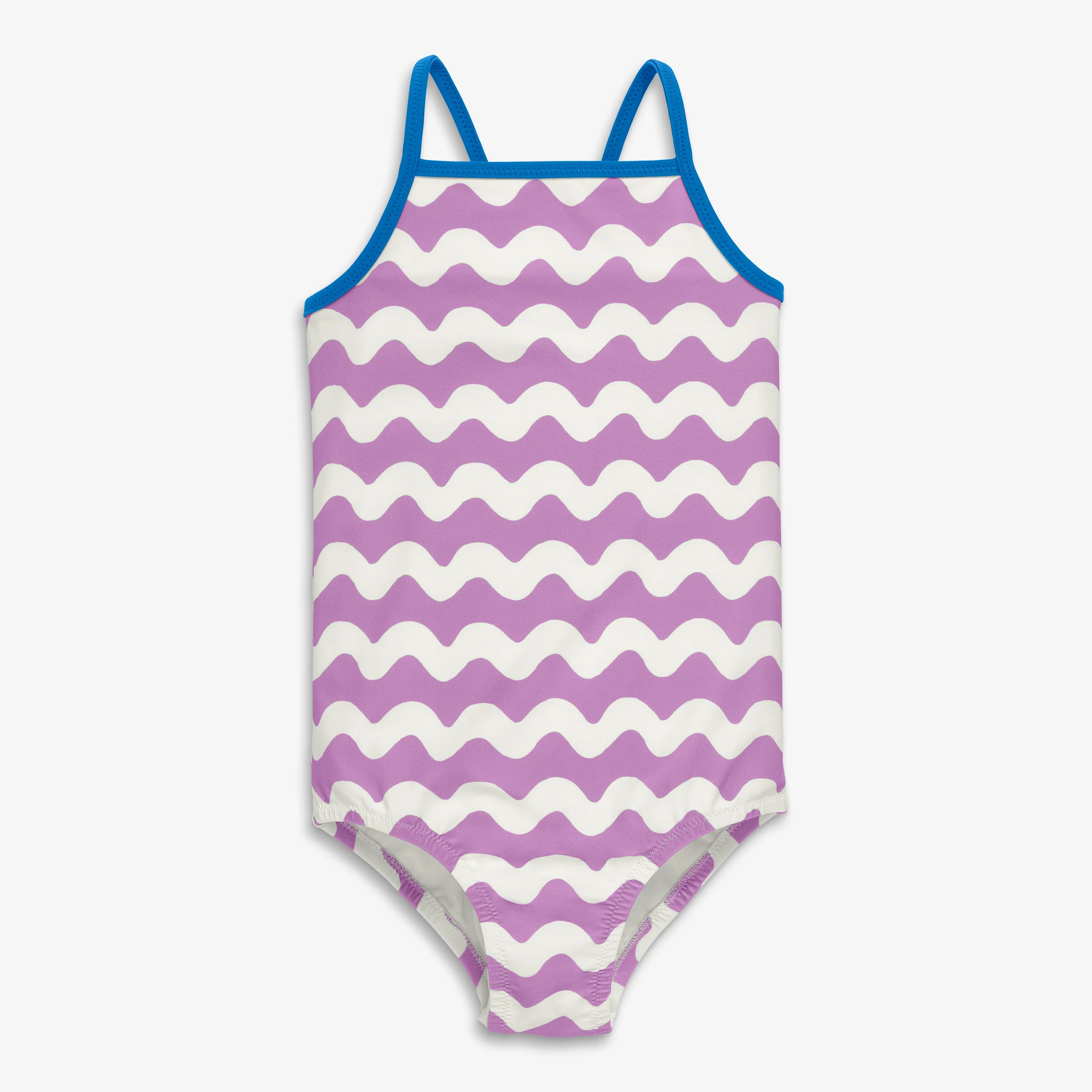 Kids swimsuit in waves