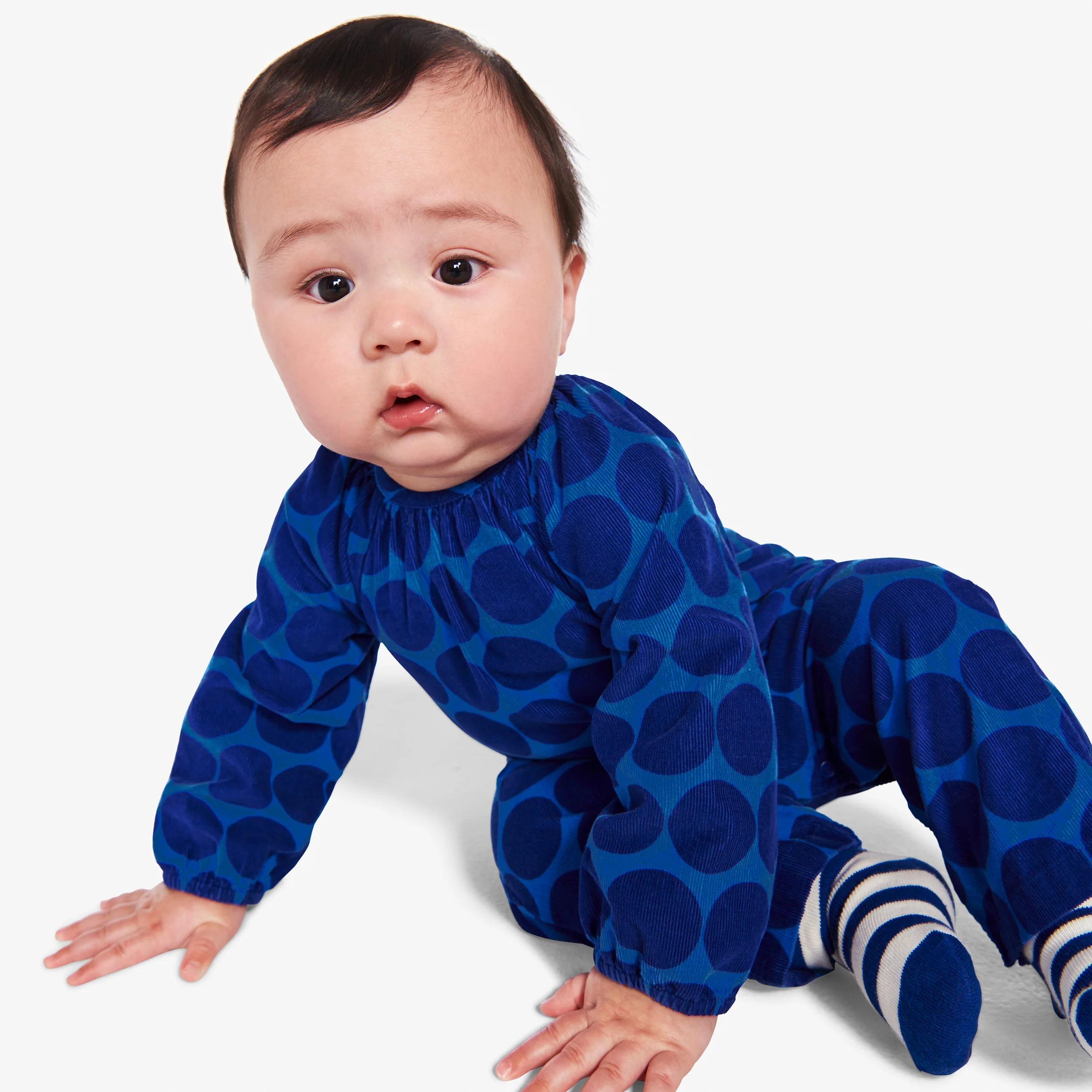 Baby corduroy romper in cutout dot