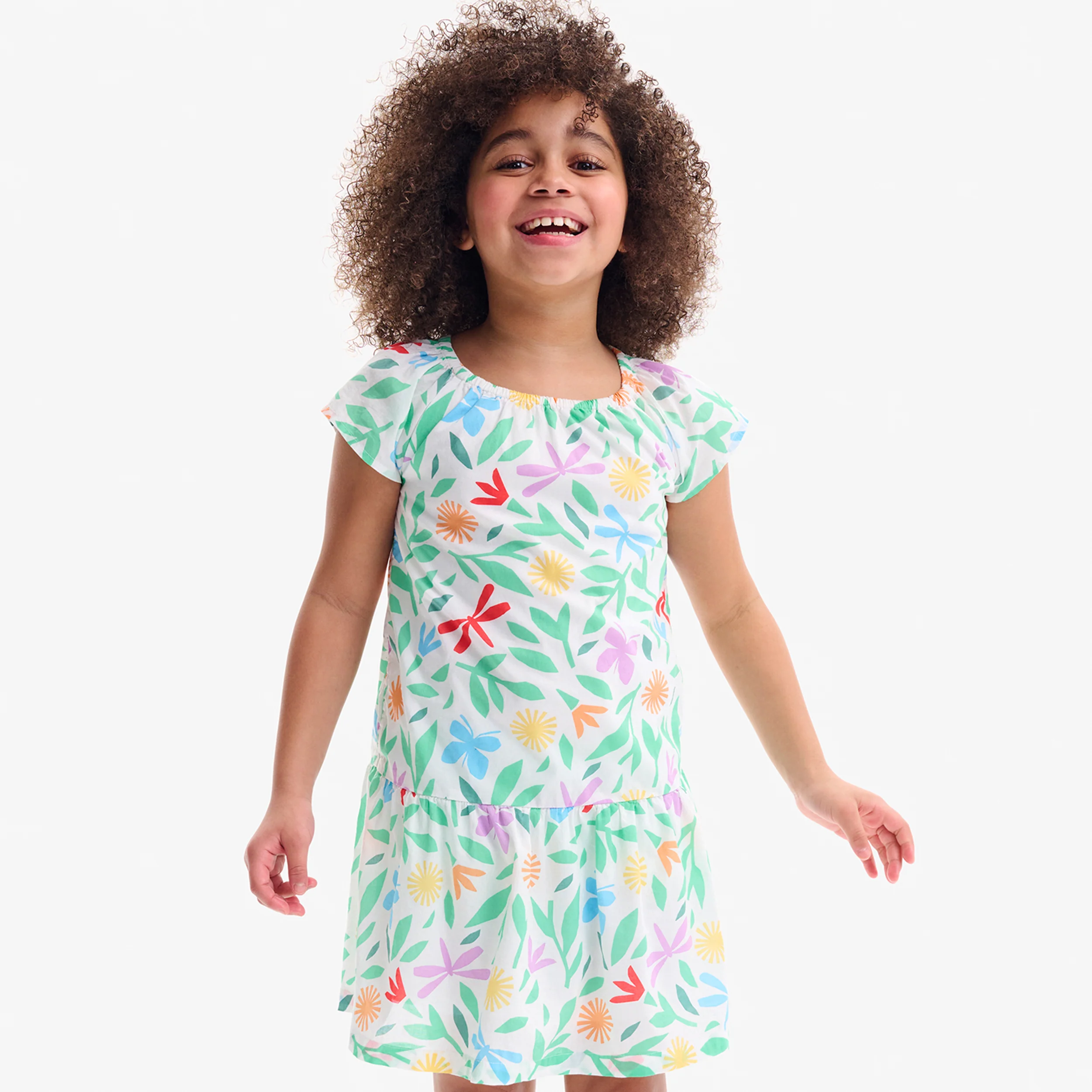 Kids swing dress in bright backyard